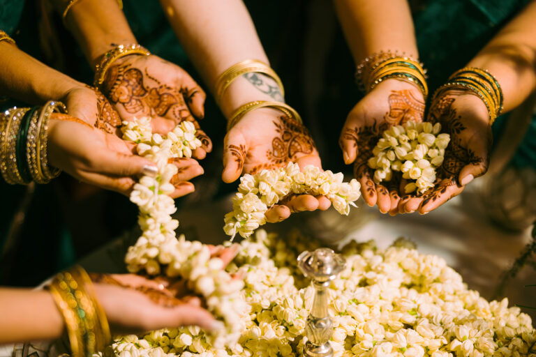 Hands holding flowers during a wedding ceremony