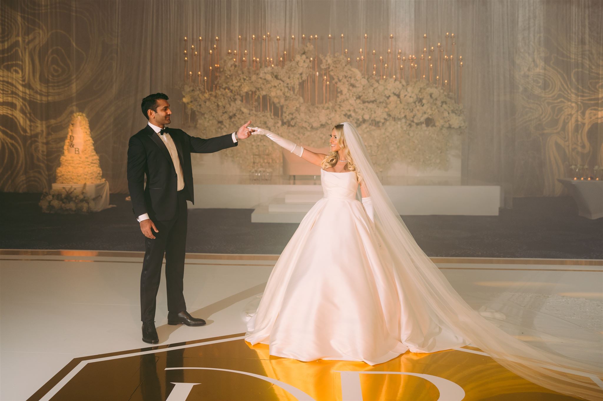 A couple sharing their first dance at a Western wedding reception