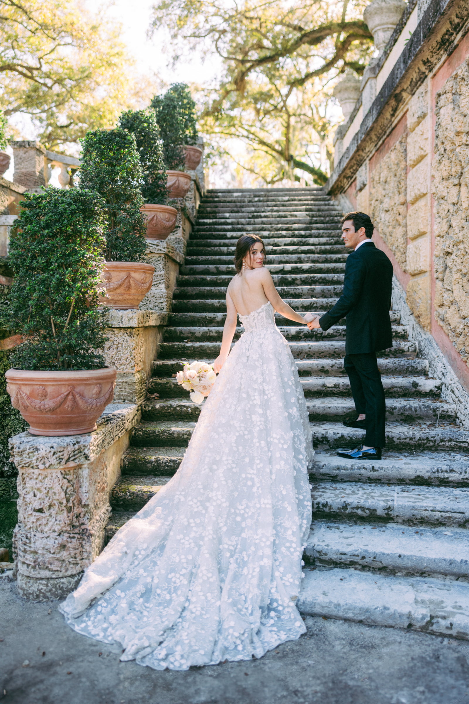 A couple together on a garden staircase