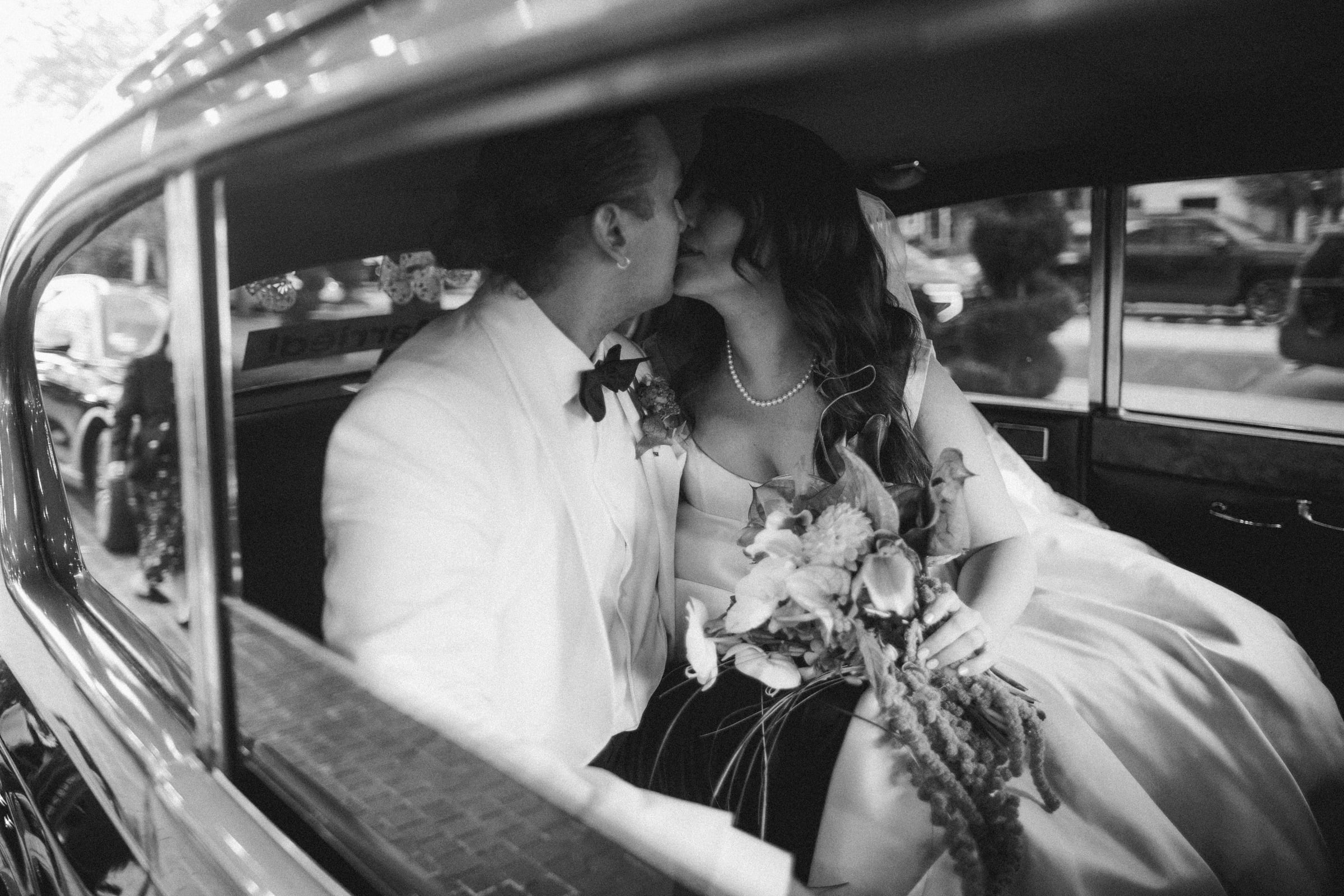 A black-and-white photograph of Tatum and Nils together on their wedding day